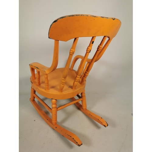 323 - A vintage orange painted pine childs farmhouse rocking chair - approx. 53cm high x 33cm wide x 51cm ... 