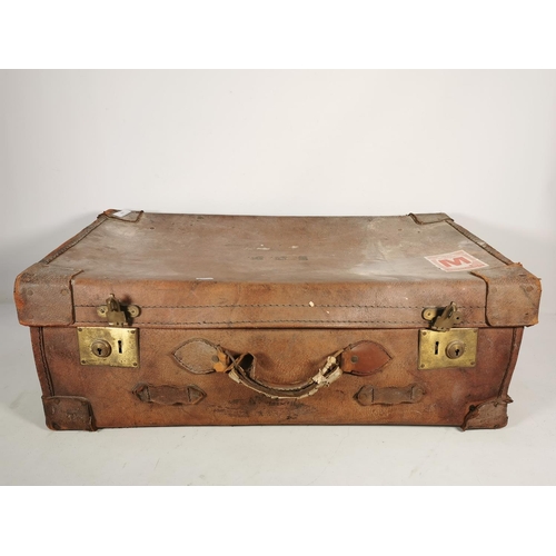 333 - A late 19th/early 20th century brown leather suitcase - approx. 28cm high x 76cm wide x 44cm deep