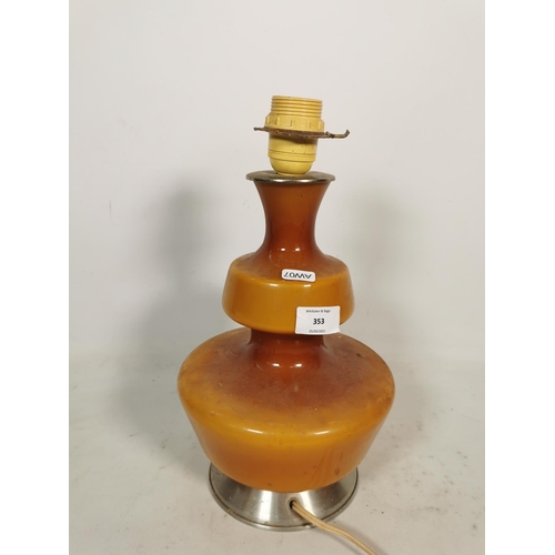 353 - A mid 20th century amber glass table lamp - approx. 29cm high