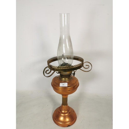 354 - A Sherwoods Ltd of Birmingham copper and brass oil lamp with glass funnel - approx. 60cm high