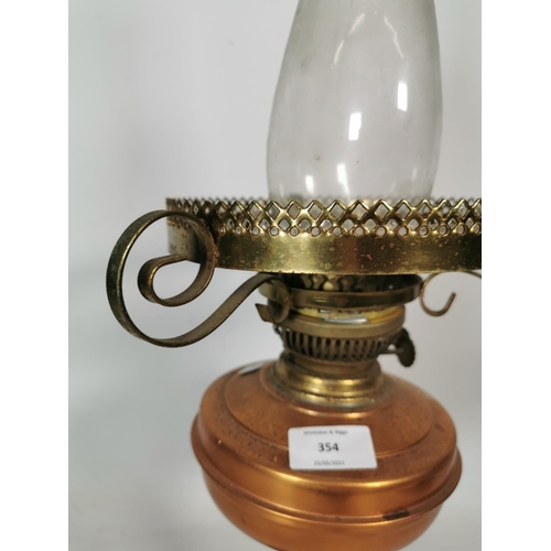 354 - A Sherwoods Ltd of Birmingham copper and brass oil lamp with glass funnel - approx. 60cm high