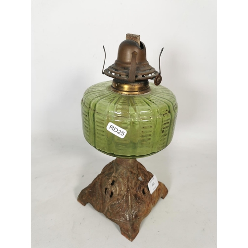 355 - A Scovill MFG Co. of U.S.A Queen Anne oil lamp with green glass reservoir and cast iron base - appro... 