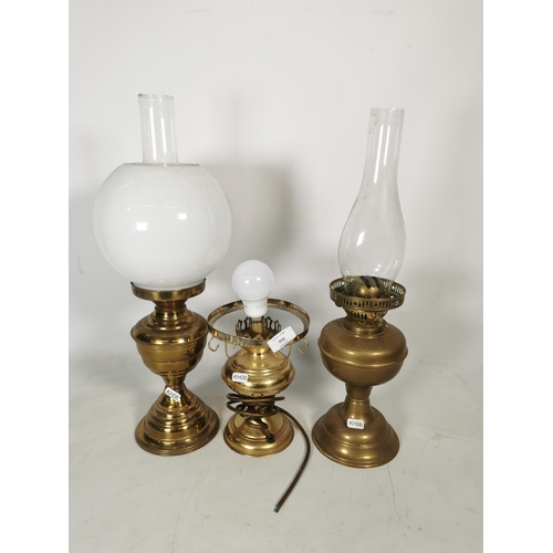 356 - Three various brass lamps, one table lamp and two Duplex oil lamps