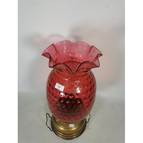 357 - A Veritas brass oil lamp with cranberry glass shade - approx. 55cm high