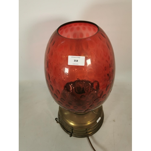 358 - A Veritas brass electric converted oil lamp with cranberry glass shade - approx. 47cm high