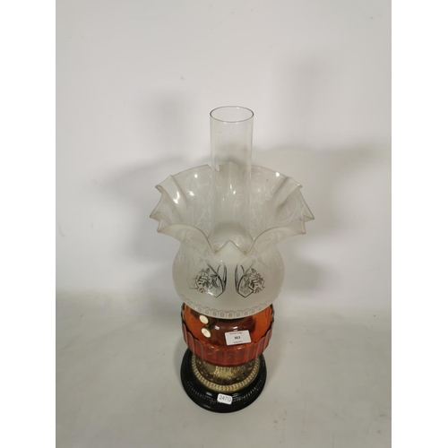 363 - A brass oil lamp with amber glass reservoir, clear glass funnel and etched glass shade - approx. 53c... 