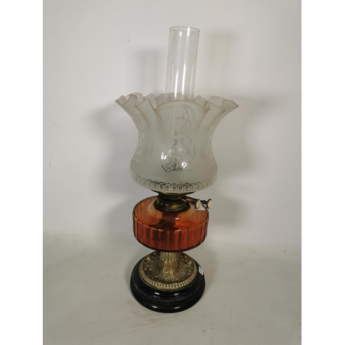 363 - A brass oil lamp with amber glass reservoir, clear glass funnel and etched glass shade - approx. 53c... 