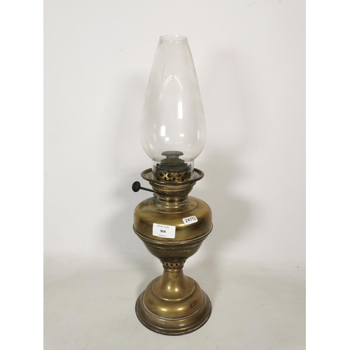 364 - A brass oil lamp with clear glass funnel - approx. 50cm high