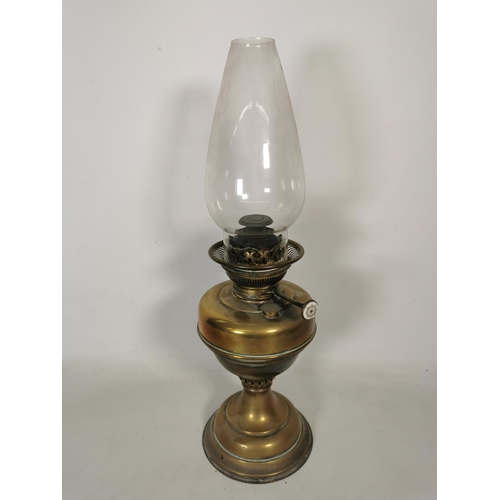 364 - A brass oil lamp with clear glass funnel - approx. 50cm high