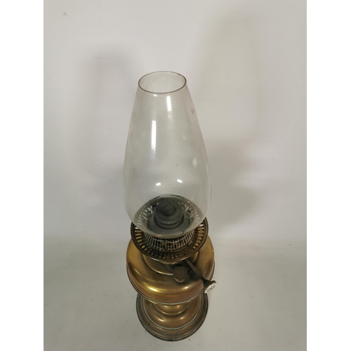 364 - A brass oil lamp with clear glass funnel - approx. 50cm high