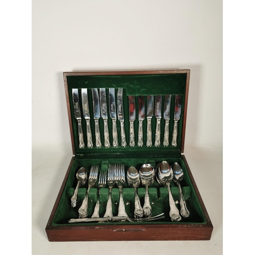 375 - A vintage mahogany cased canteen of stainless steel cutlery