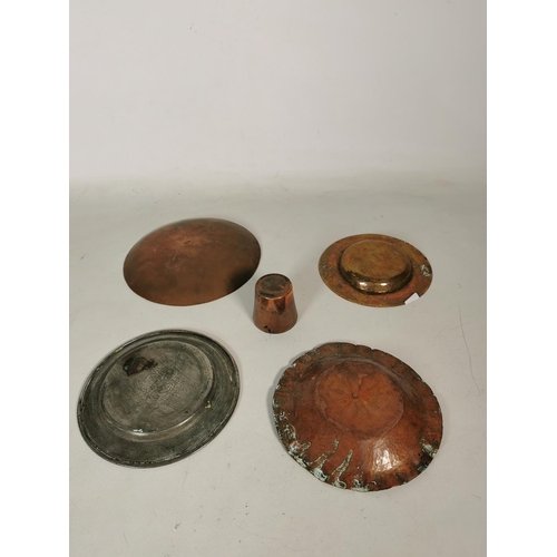 376 - Four assorted vintage copper dishes and one copper measuring cup