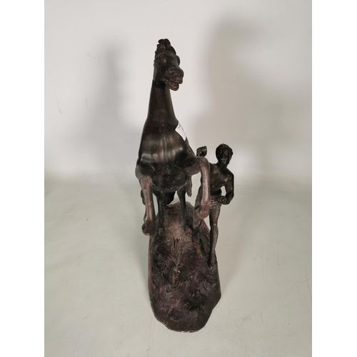 379 - A large spelter rearing horse and man figurine - approx. 40cm high