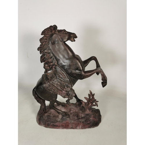 379 - A large spelter rearing horse and man figurine - approx. 40cm high