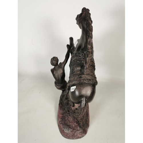 379 - A large spelter rearing horse and man figurine - approx. 40cm high