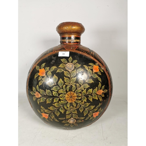 380 - An unusual hand painted black metal vase with floral design - approx. 46cm high