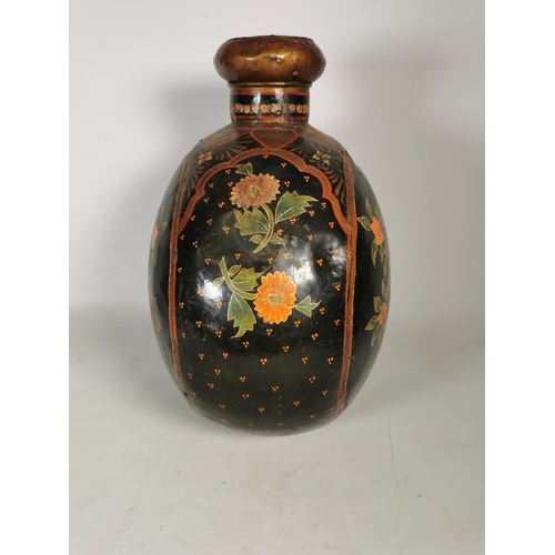 380 - An unusual hand painted black metal vase with floral design - approx. 46cm high