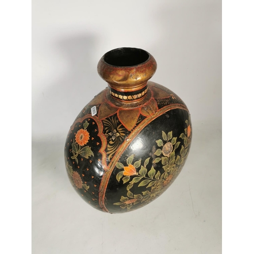 380 - An unusual hand painted black metal vase with floral design - approx. 46cm high