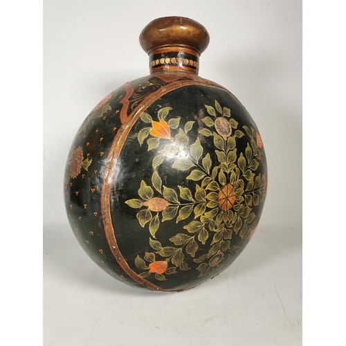 380 - An unusual hand painted black metal vase with floral design - approx. 46cm high