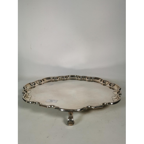 381 - A vintage EPNS tri footed salver with scalloped edge - approx. 42cm square