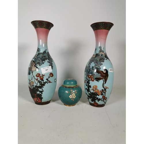 387 - Three pieces of cloisonné to include two vases with bird design - approx. 30cm high and one ginger j... 