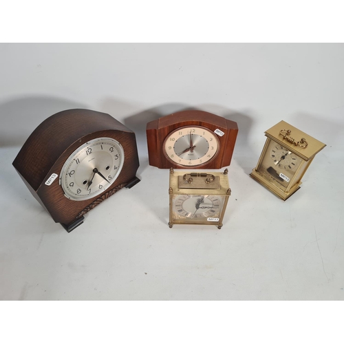 391 - Four various clocks, one West German Eastyma quartz mantel clock, one German Canterbury brass cased ... 