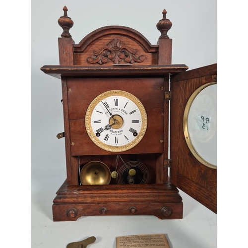 397 - A vintage Fattorini & Sons of Bradford oak cased automatic alarm eight day mantel clock with key - a... 