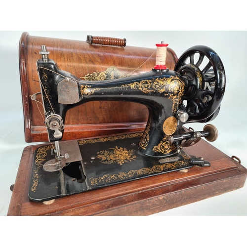 398 - A vintage oak cased Singer sewing machine