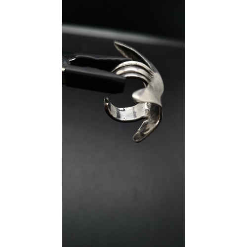 100 - A hallmarked 925 silver claw ring - approx. gross weight 8.81 grams