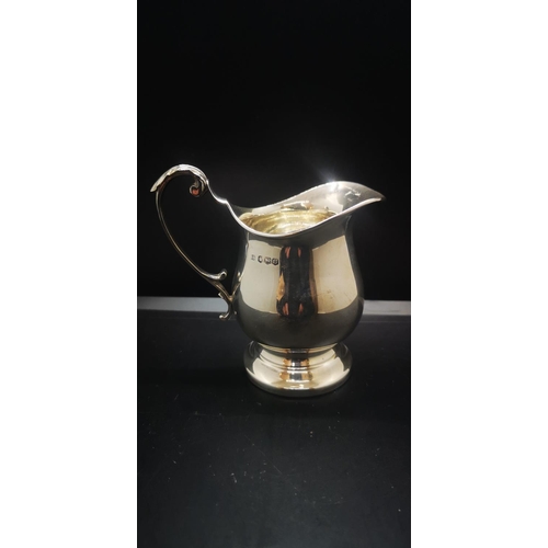15 - A hallmarked Sheffield silver milk jug with acanthus leaf design handle, dated 1962 - approx. gross ... 