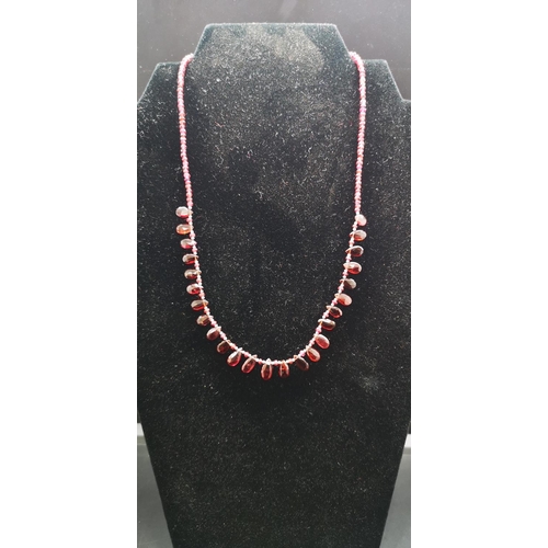 163 - A garnet gemstone bead necklace with 925 silver clasp