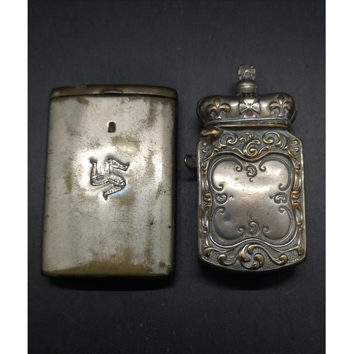51 - Two vintage silver plated vesta cases, one with Legs of Man logo and the other with acanthus leaf an... 