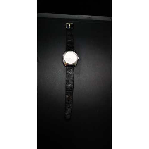 64 - A vintage Bulova waterproof wristwatch with black leather strap