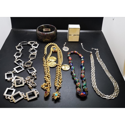 79 - A collection of assorted costume jewellery to include Liberty Danish made bangle, white metal neckla... 