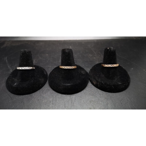 88 - A set of three hallmarked 9ct gold rings all with three inset diamonds each, one yellow gold - 1.14 ... 