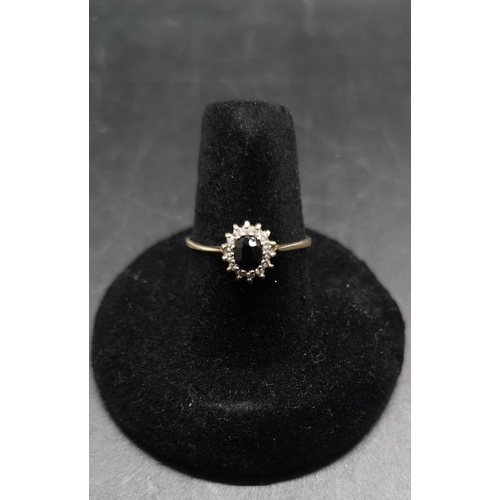94 - A hallmarked 9ct gold diamond ring with inset black stone, size Q ½ - approx. gross weight 1.35 gram... 