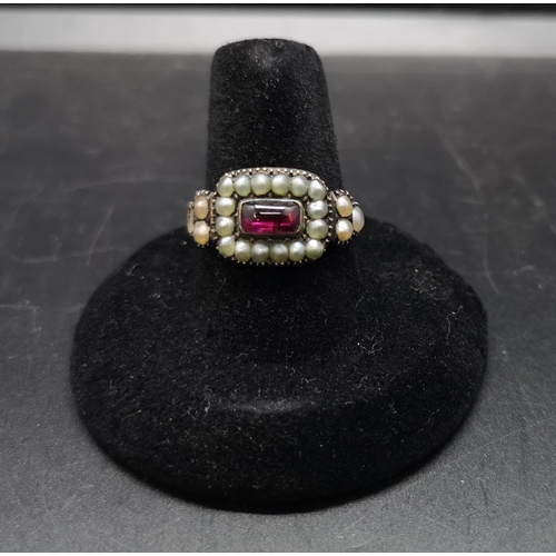 97 - A Georgian yellow metal ruby and seed pearl ring, size S and approx. 3.72 grams