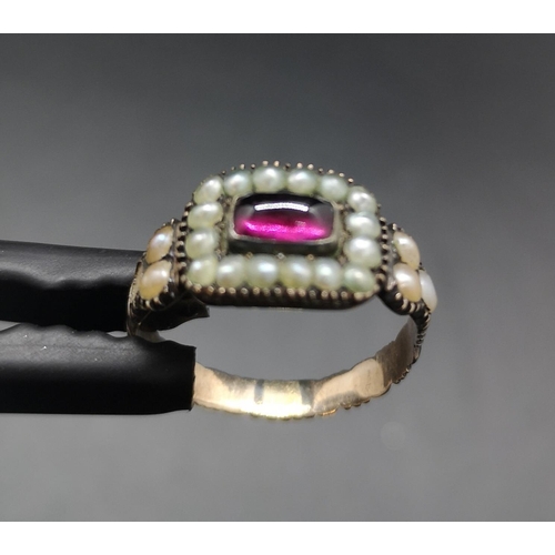 97 - A Georgian yellow metal ruby and seed pearl ring, size S and approx. 3.72 grams