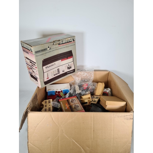 456 - A large quantity of model railway accessories to include buildings, Tri-Ang P.5 power unit, boxed Ho... 