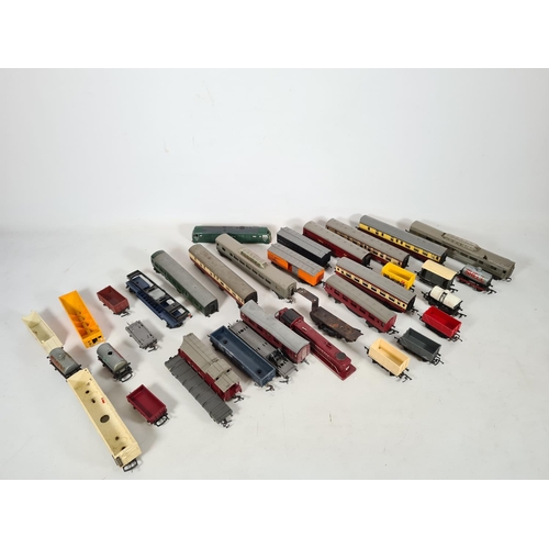 458 - A large quantity of model railway accessories to include coaches, tenders, fuel tankers etc.