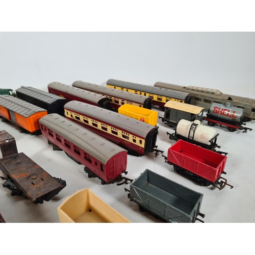 458 - A large quantity of model railway accessories to include coaches, tenders, fuel tankers etc.
