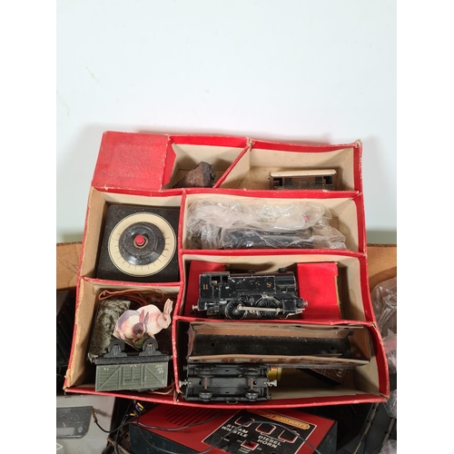 460 - A box containing a large quantity of model railway accessories to include track, power units, passen... 