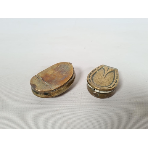 259 - Two brass snuff boxes, one 19th century brass curved example and one horseshoe example