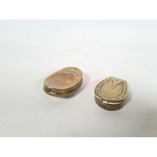 259 - Two brass snuff boxes, one 19th century brass curved example and one horseshoe example