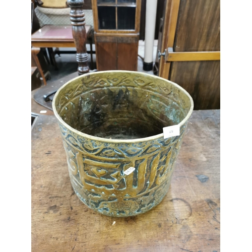 478 - A Middle Eastern embossed brass coal bucket with elephant and lion design - approx. 28cm high x 32cm... 