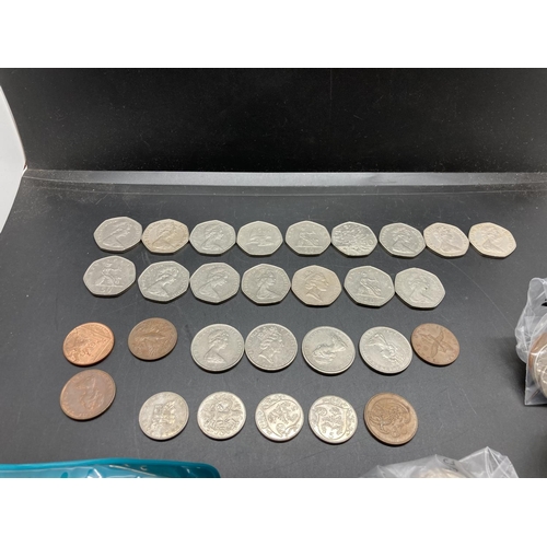 188 - A collection of coins and tokens to include 1994 'Normandy Invasion' 50p, 1981 Irish 50p, 1973 'E.E.... 