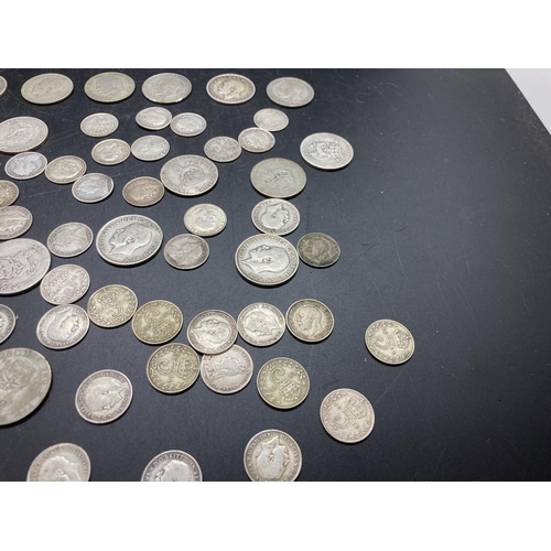 191 - A collection of mostly British silver coins to include twenty two shillings, one 1943 South African ... 