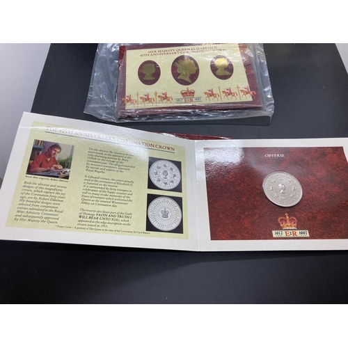 195 - Three Royal Mint issue envelopes containing Elizabeth II 40th Anniversary Coronation crown coins