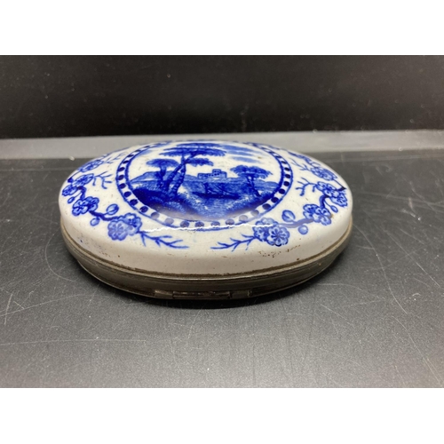 235 - A 19th century blue and white ceramic snuff box - 8.5cm x 6.5cm