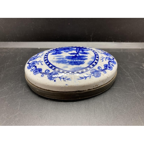 235 - A 19th century blue and white ceramic snuff box - 8.5cm x 6.5cm